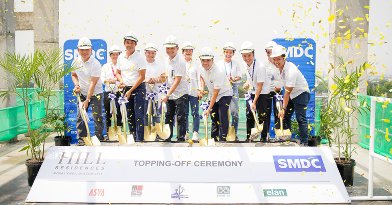 Employees in white with white hard hats